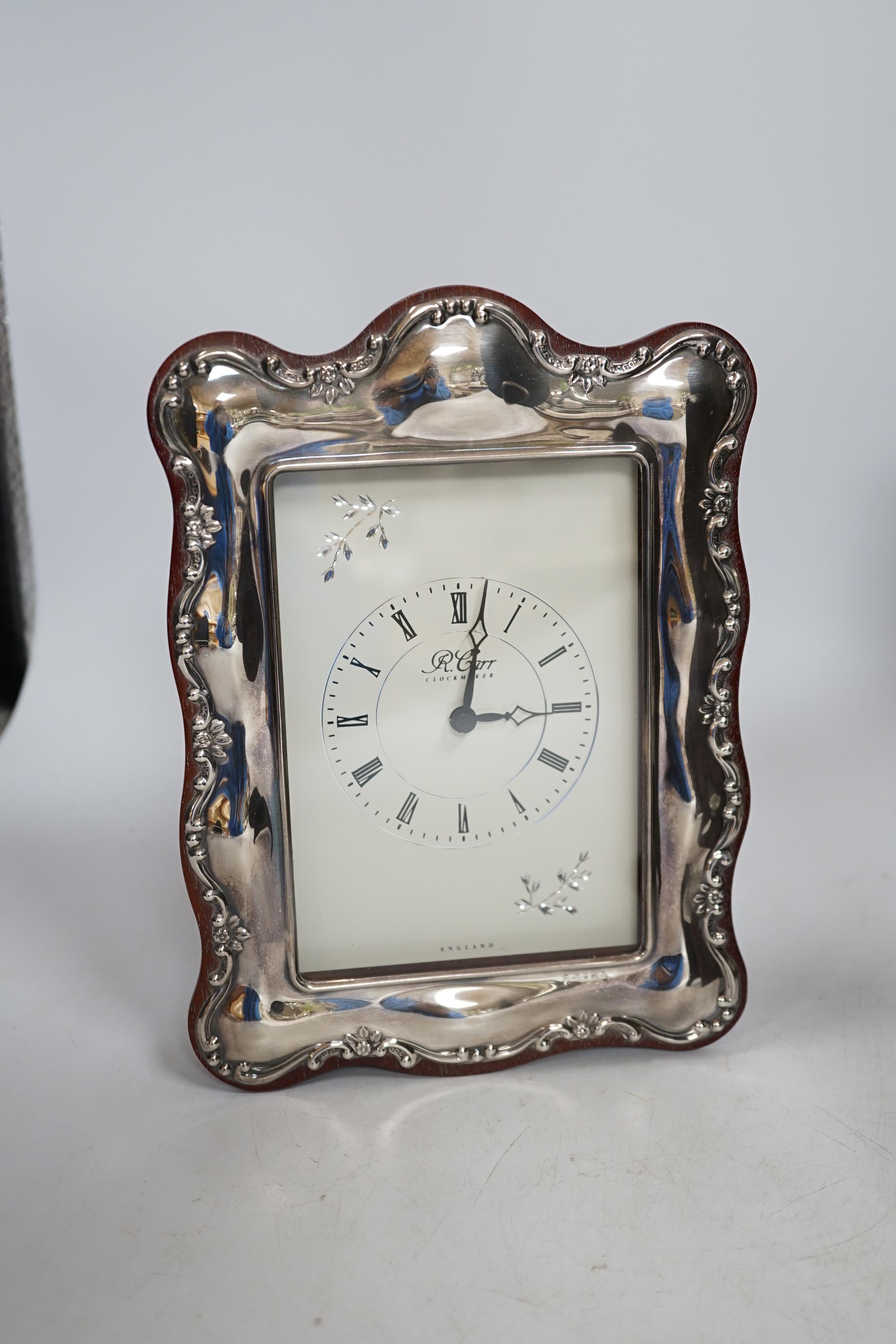 Two modern Carrs silver photograph frames, one of Art Nouveau design, 21cm, and a similar timepiece, 21cm